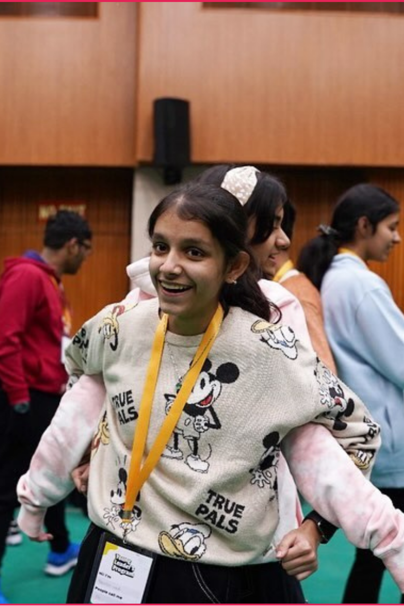 Participants laughing during a theatre workshop